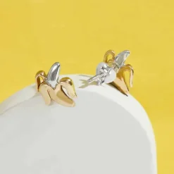 Zilveren/bronzen studs banaan